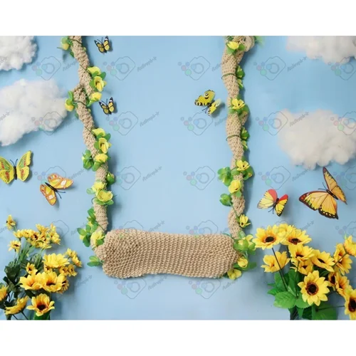 بک دراپ نوزاد تاب در آسمان بهاری با دکور گل و پروانه-کد 5170